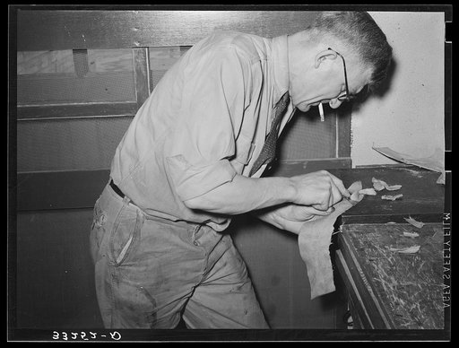 Hand skiving of leather. Saddle shop, Alpine, Texas