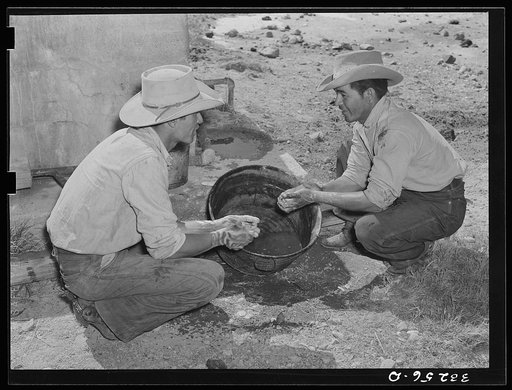 Mexican cowboys washing up after roundup. Cattle ranch near Marfa, Texas