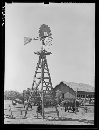 Windmill, watering trough and barn on SMS Ranch near Spur, Texas