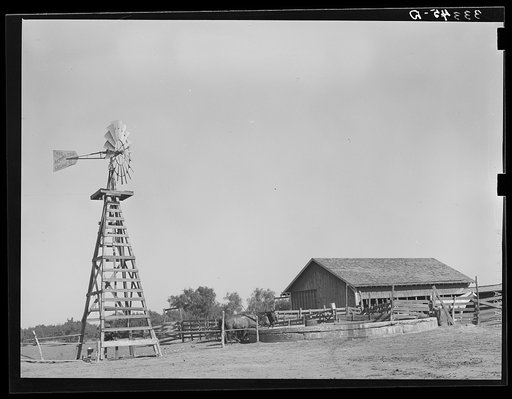 Untitled photo, possibly related to: Windmill, watering trough and barn on SMS Ranch near Spur, Texas