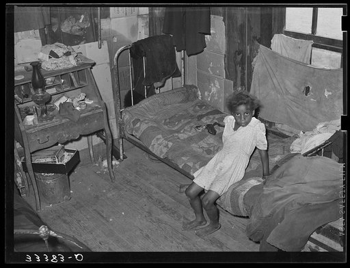 Interior of Negro agricultural day laborer's home in Muskogee County, Oklahoma. These houses rent from two to five dollars per month