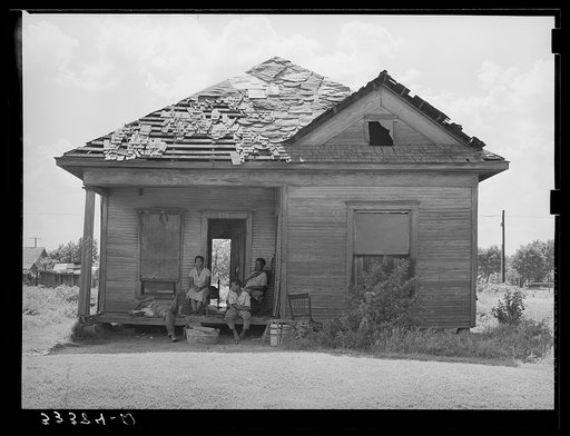 Home of Negro agricultural day laborer's home in Muskogee County, Oklahoma. These houses rent from two to five dollars per month. Muskogee County, Oklahoma