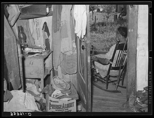 Corner of bedroom of Negro agricultural day laborer's home. Muskogee County, Oklahoma