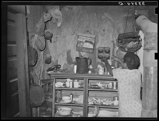 Kitchen cabinet in the home of Negro agricultural day laborer. Muskogee, Oklahoma. Note lunch pail