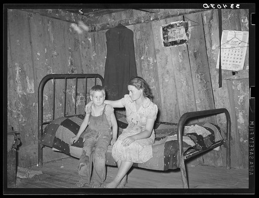 Daughter and son of agricultural day laborer living near Webbers Falls, Oklahoma. The furnishings of this shack were meager and broken and filthy.  Muskogee County