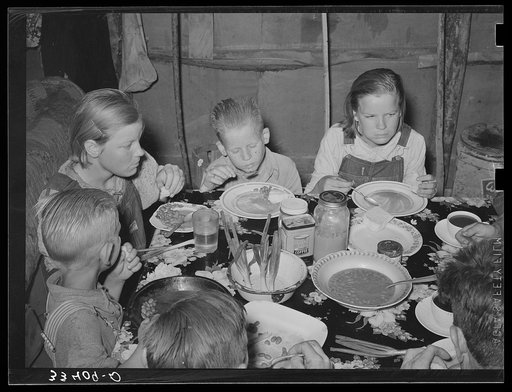 Children of agricultural day laborer eating their noonday meal near Webbers Falls, Oklahoma. Muskogee County