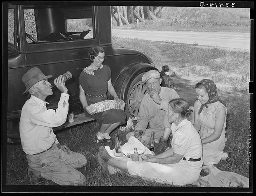 Migrant steeple-jack and his family eating a "bought lunch" by the roadside Near Prague, Oklahoma, Lincoln County