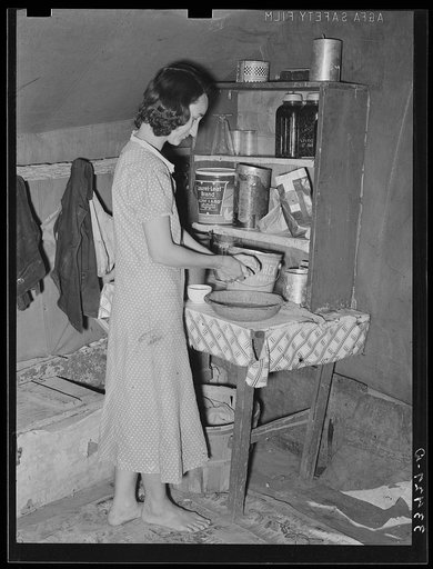 Wife of day laborer in kitchen in camp in Arkansas River bottom near Webbers Falls, Oklahoma. Muskogee County