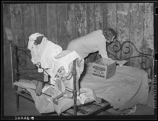 Bedroom of one-room shack of day laborer living near Warner, Oklahoma. Muskogee County