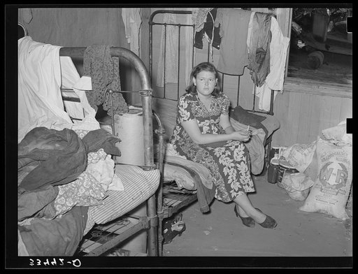 Member of migrant family group while they were camping near Muskogee, Oklahoma doing day labor to obtain funds to go to California