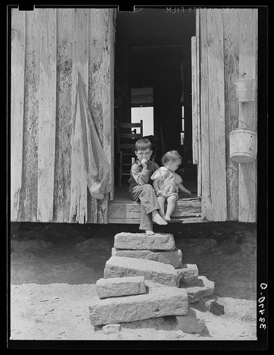 Children of tenant farmer on back steps of house near Warner, Oklahoma