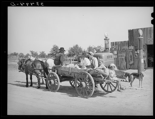 Untitled photo, possibly related to: Farmer's wagon loaded with supplies leaving crossroads store in McIntosh County, Oklahoma
