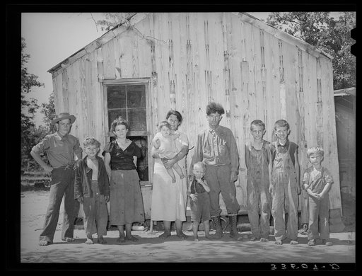 Family of agricultural day laborer, former oil worker and coal miner. The family lives in this two-room shack in McIntosh County, Oklahoma
