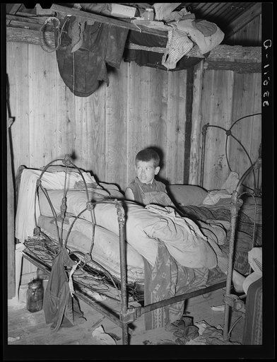 Corner of bedroom of home of agricultural day laborer. McIntosh County, Oklahoma
