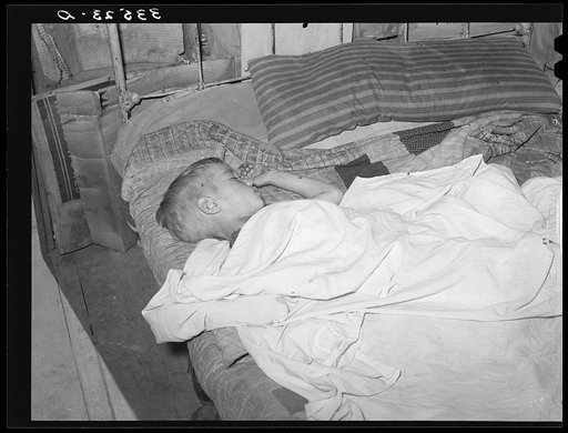 Boy asleep in house in Arkansas River bottom near Vian. Oklahoma, Sequoyah County