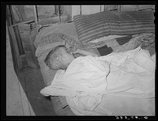 Untitled photo, possibly related to: Boy asleep in house in Arkansas River bottom near Vian. Oklahoma, Sequoyah County