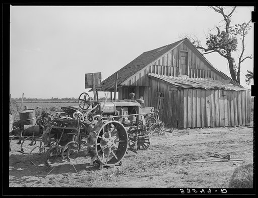 The tractor and home of a man who at one time was a tenant farmer but who is now a day laborer. Wagoner County, Oklahoma