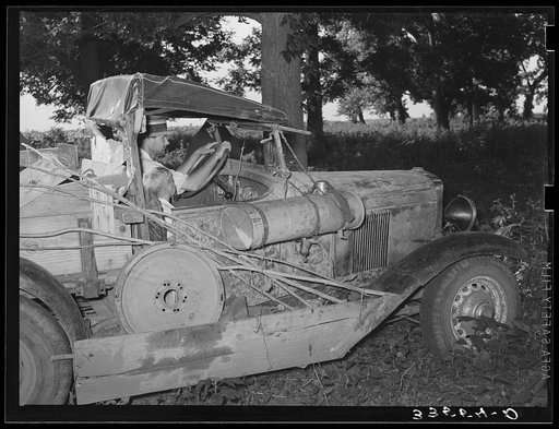 Migrant agricultural worker from Texas in his automobile in Wagoner County, near Tullahassee, Oklahoma