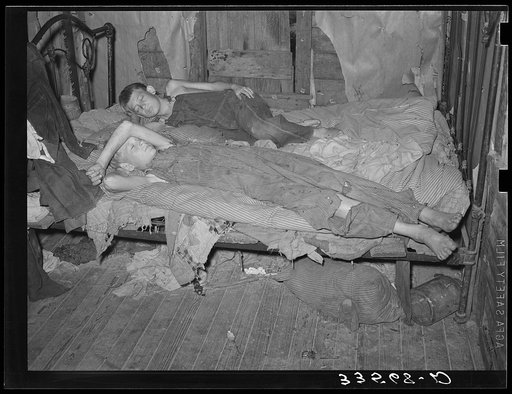 Sons of agricultural day laborer taking a nap. McIntosh County, Oklahoma