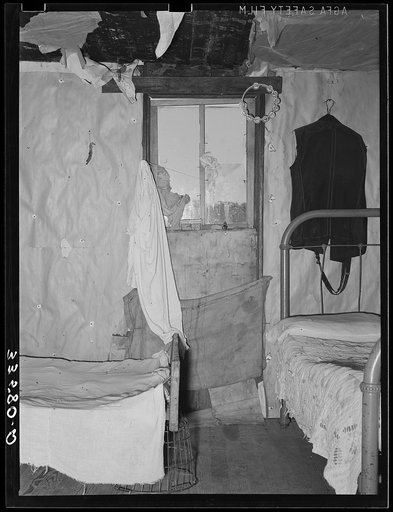 Bedroom and living room in home of white agricultural day laborer near Tullahassee, Oklahoma. Wagoner County
