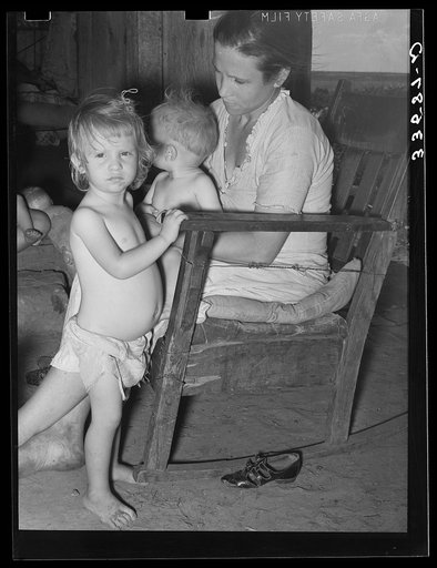 Wife of agricultural day laborer and her children near Tullahassee, Oklahoma. Wagoner County
