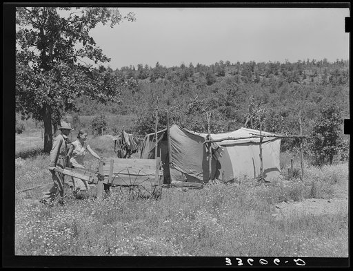 Camp of migrant agricultural day laborers who moved their goods along the road in this push cart. Camp is near Vian, Oklahoma, Sequoyah County