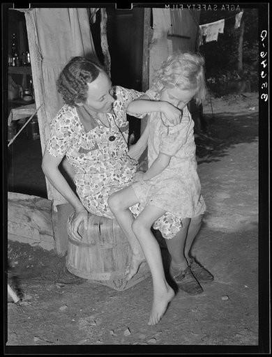 Untitled photo, possibly related to: Mother and child of agricultural day laborers family encamped near Spiro. Sequoyah County, Oklahoma
