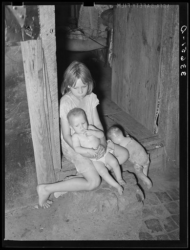 Children of agricultural day laborer in doorway of home near Tullahassee, Oklahoma. Wagoner County