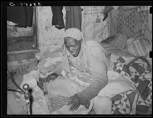 Untitled photo, possibly related to: Old Negress, wife of agricultural day laborer, in bed with rheumatism. Wagoner County, Oklahoma