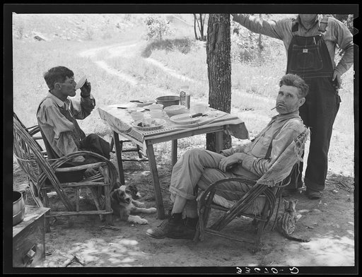 Visiting farmers who were having lunch at agricultural day laborer's camp near Sallisaw, Oklahoma