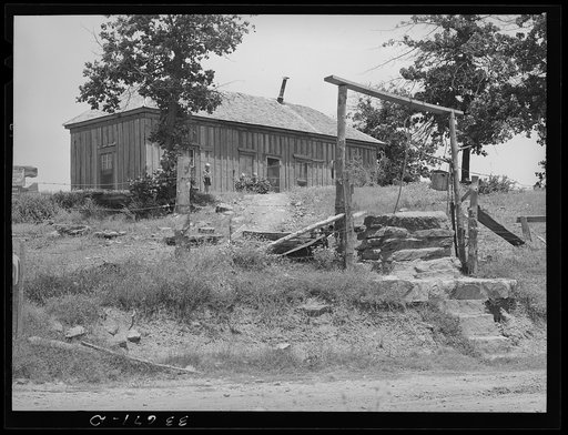 Well and home of tenant farmer near Sallisaw, Oklahoma