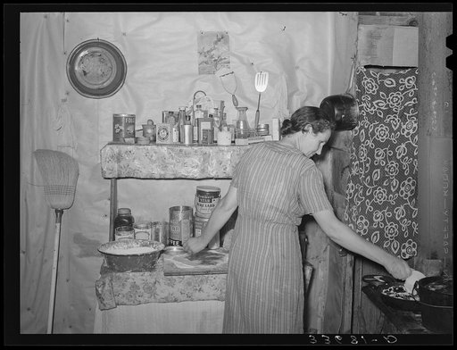 Wife of farmer now on WPA (Works Progress Administration/Work Projects Administration) roadwork making blackberry pie. Near Sallisaw, Oklahoma