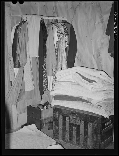 Corner of bedroom of farm family who are now on WPA (Works Progress Administration/Work Projects Administration). Near Sallisaw, Oklahoma. Notice crowded conditions
