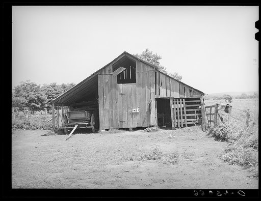 Barn of farmer now on WPA (Works Progress Administration/Work Projects Administration) roadwork. Near Sallisaw, Oklahoma
