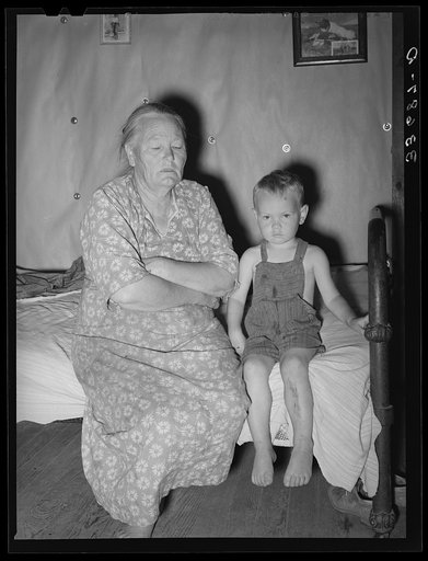 Woman tenant farmer with her grandson. Her husband is dead and she is farming with the help of three near-grown sons near Sallisaw, Oklahoma