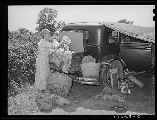 Belongings of migrant family packed in and around car near Muskogee, Oklahoma. Muskogee County