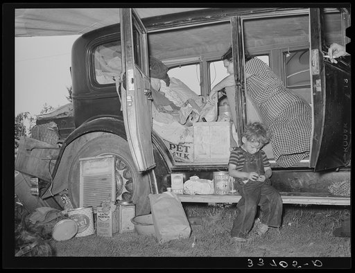 Belongings of migrant family packed in and around car near Muskogee, Oklahoma. Muskogee County