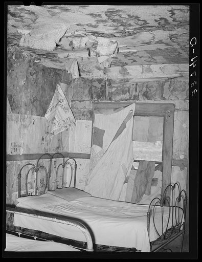 Bedroom of Negro agricultural day laborer living in small town in Muskogee County, Oklahoma
