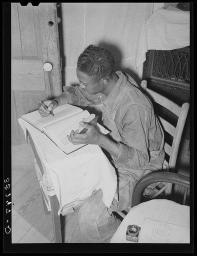 Negro church member working on church books. Muskogee County, Oklahoma