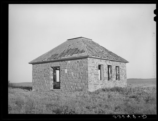 Abandoned brick schoolhouse. McIntosh County, Oklahoma. The tendency is towards consolidation of county schools