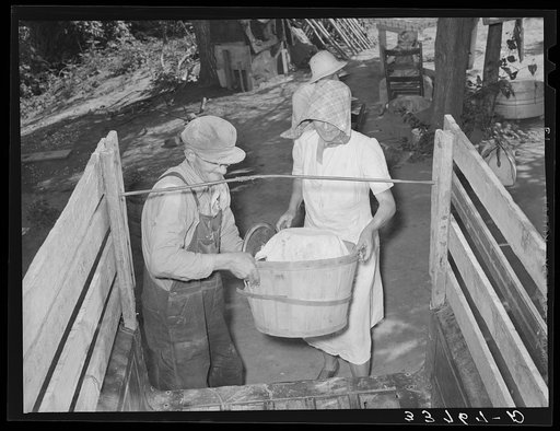 Untitled photo, possibly related to: Migrant family loading truck preparatory to departure for California. Near Muskogee, Oklahoma