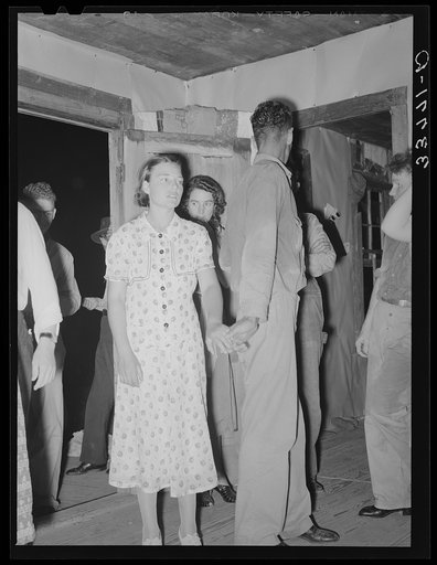 Young couple at square dance in rural section of hills near McAlester, Pittsburg County, Oklahoma. Sharecropper's home