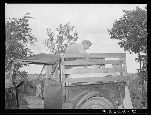 Untitled photo, possibly related to: Migrant family loading truck preparatory to departure for California. Near Muskogee, Oklahoma