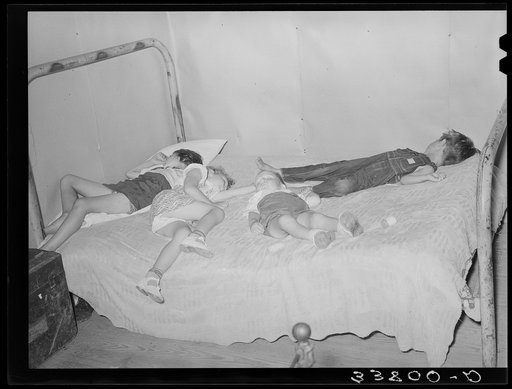 Children asleep on bed at square dance in hills near McAlester on Saturday night in home of sharecropper. Oklahoma, Pittsburg County