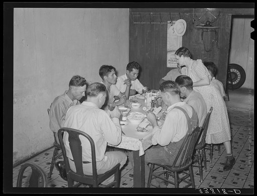 Noonday dinner, family-style, at restaurant in Muskogee, Oklahoma. The price of this dinner was fifteen cents. It included a medium-sized serving of meat, sliced tomatoes and corn on the cob, potatoes, dumplings, corn bread and butter, tea and coffee, various jellies and preserves and onions. All yo