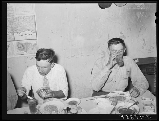 Man eating dinner at family-style restaurant. Muskogee, Oklahoma