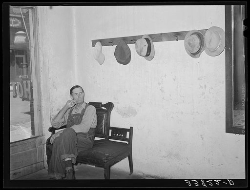 Man waiting for a seat at the table in family-style restaurant. Muskogee, Oklahoma