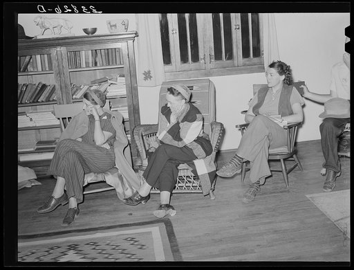 Women staying at nearby lodge listening to the boys in the summer camp singing. El Porvenir, New Mexico