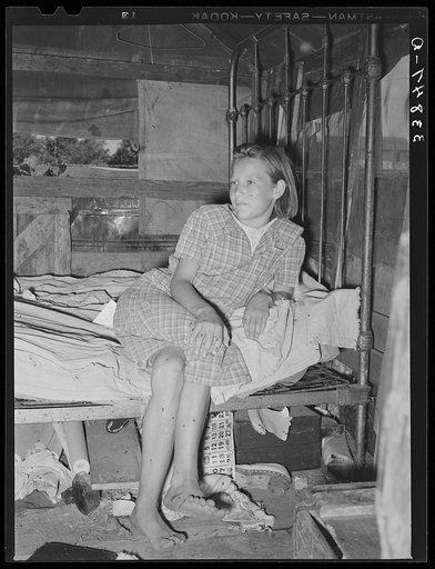 Daughter of family living in Mays Avenue camp. Oklahoma City, Oklahoma.  This family had been farmers in Oklahoma until four years ago. Since then they have lived in a community camp, getting some food from the vegetable dumps, doing "trashing" and going on the road occasionally as migrant workers. 