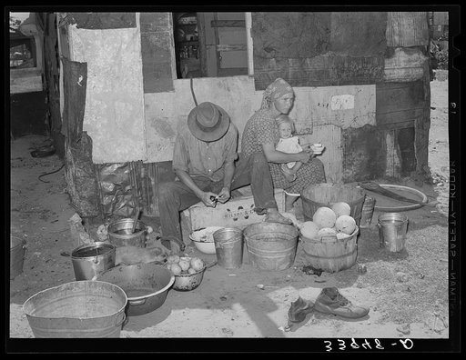 Family living in Mays Avenue camp. Oklahoma City, Oklahoma. This family had been farmers in Oklahoma until four years ago. Since then they have lived in a community camp, getting some food from the vegetable dumps, doing "trashing" and going on the road occasionally as migrant workers. They have bee